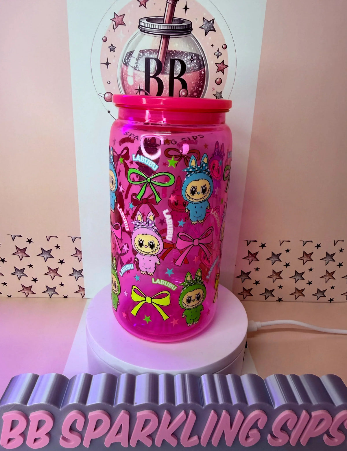 Pink glitter tumbler with Labubu characters and bows, UV DTF cup wrap design