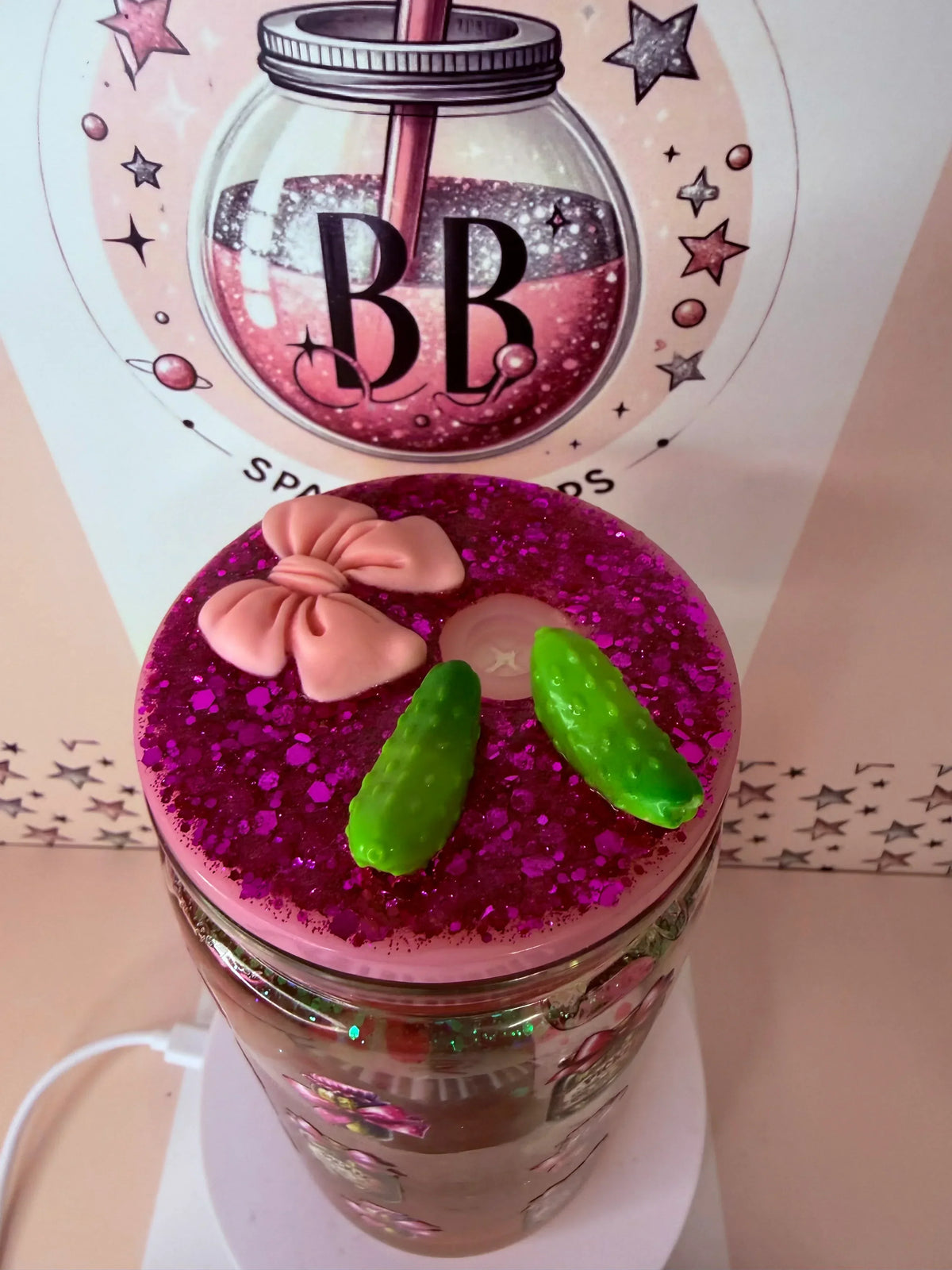 Pink glitter mason jar cup with green gummy pickles and bow, handmade custom tumbler