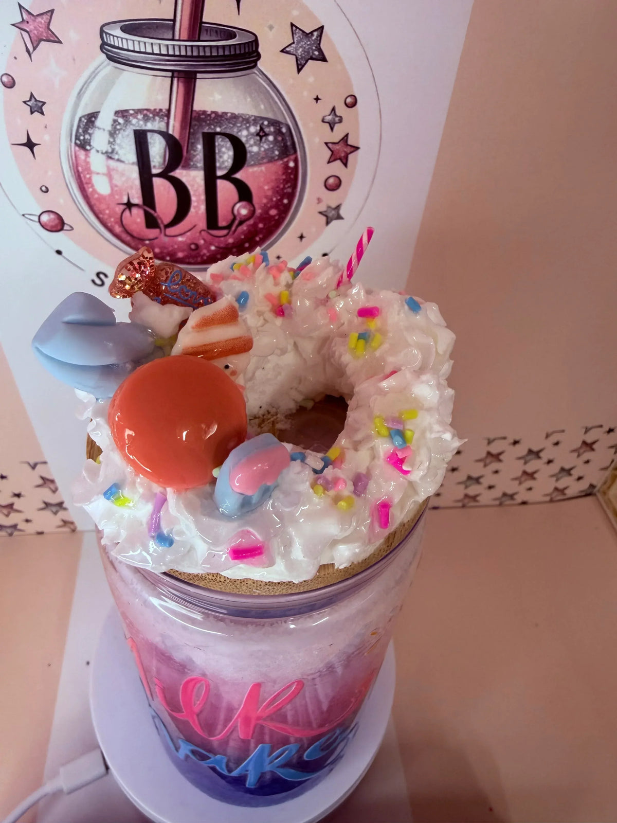 Custom glitter tumbler with whipped cream, sprinkles, donut, and macaron topping, handmade in UK